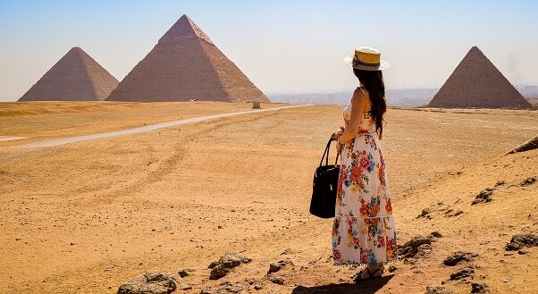 woman looking to pyramids